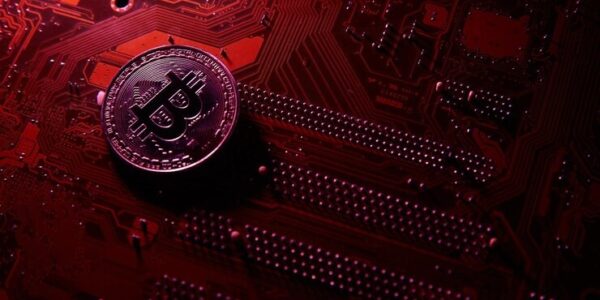 Tesla logo beside a Bitcoin chart showing a sharp rise and gradual fall, symbolizing Tesla’s shifting influence in the crypto market.