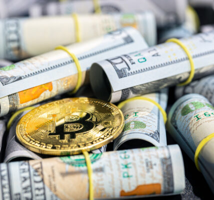Bitcoin placed on rolled U.S. dollar bills, symbolizing the shifting financial landscape as crypto gains traction amid global tariff policies.