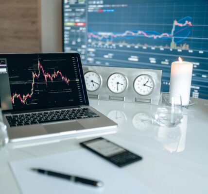 Tablet showing digital crypto charts and icons, reflecting anxiety in the market ahead of major political developments.