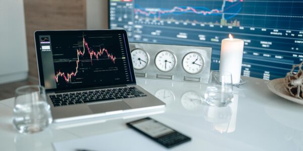 Tablet showing digital crypto charts and icons, reflecting anxiety in the market ahead of major political developments.